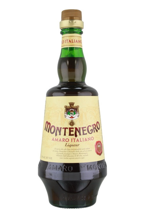 Bottle of Amaro Montenegro Amaro Italiano with its cream label, crest and rounded green glass shoulders