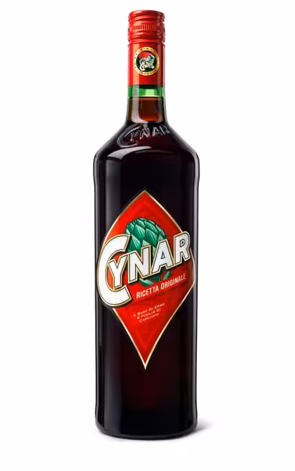 Bottle of Cynar artichoke amaro with its dark liquid and the green artichoke label against a plain background
