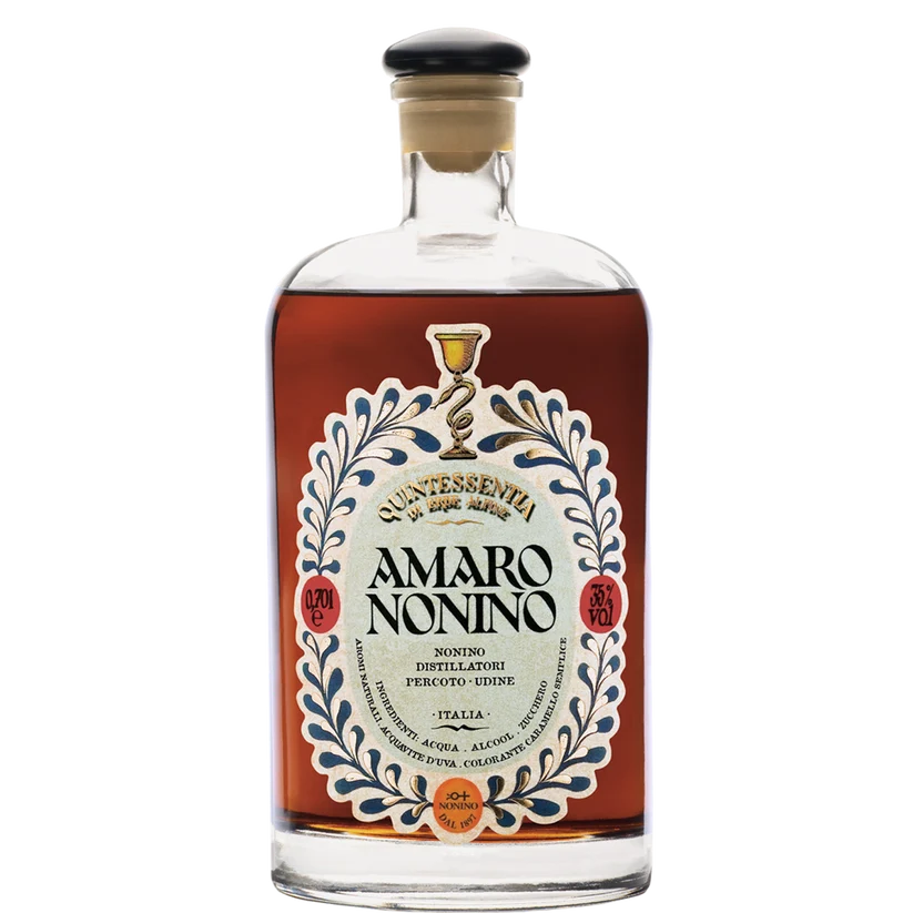 Bottle of Amaro Nonino Quintessentia with its ornate blue and cream label and black cap, a grappa-based amaro from Percoto, Friuli